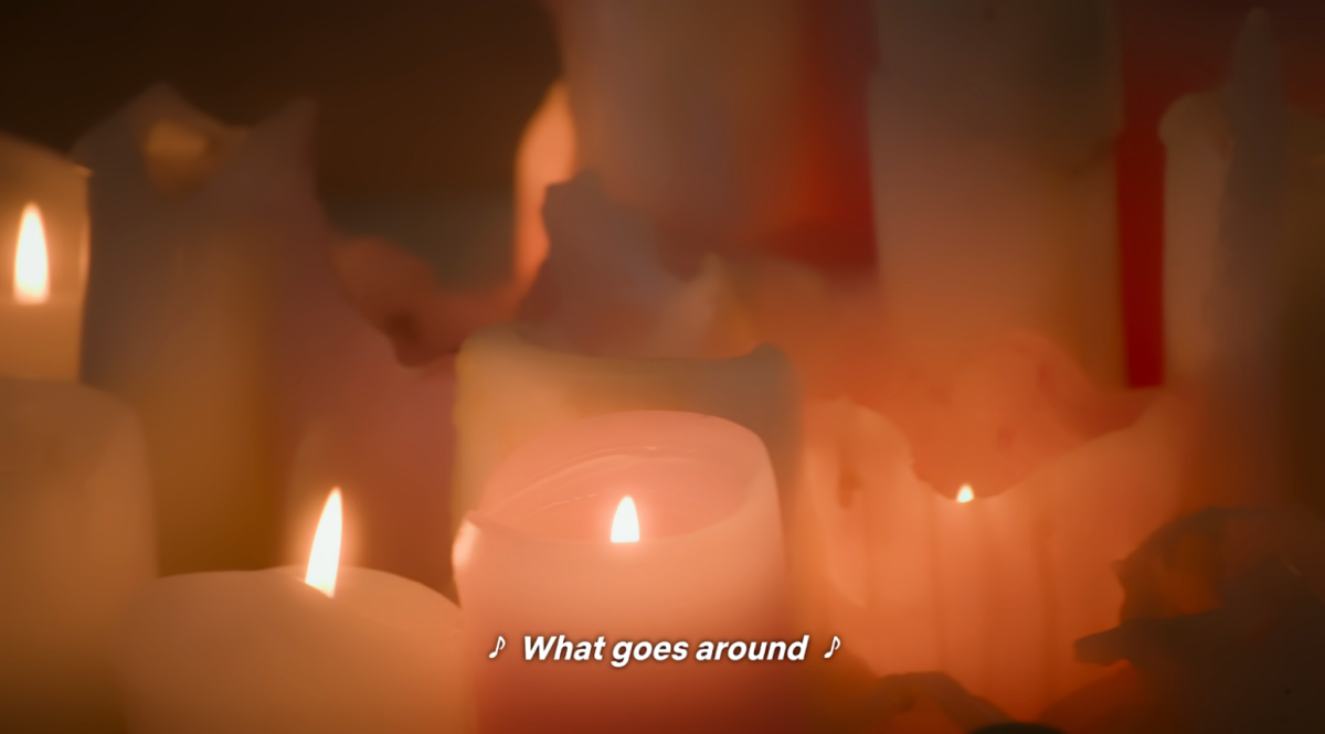 Several light pink candles fill the screen